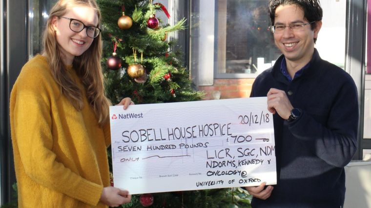A photo of the cheque presentation of £700 to Sobell House